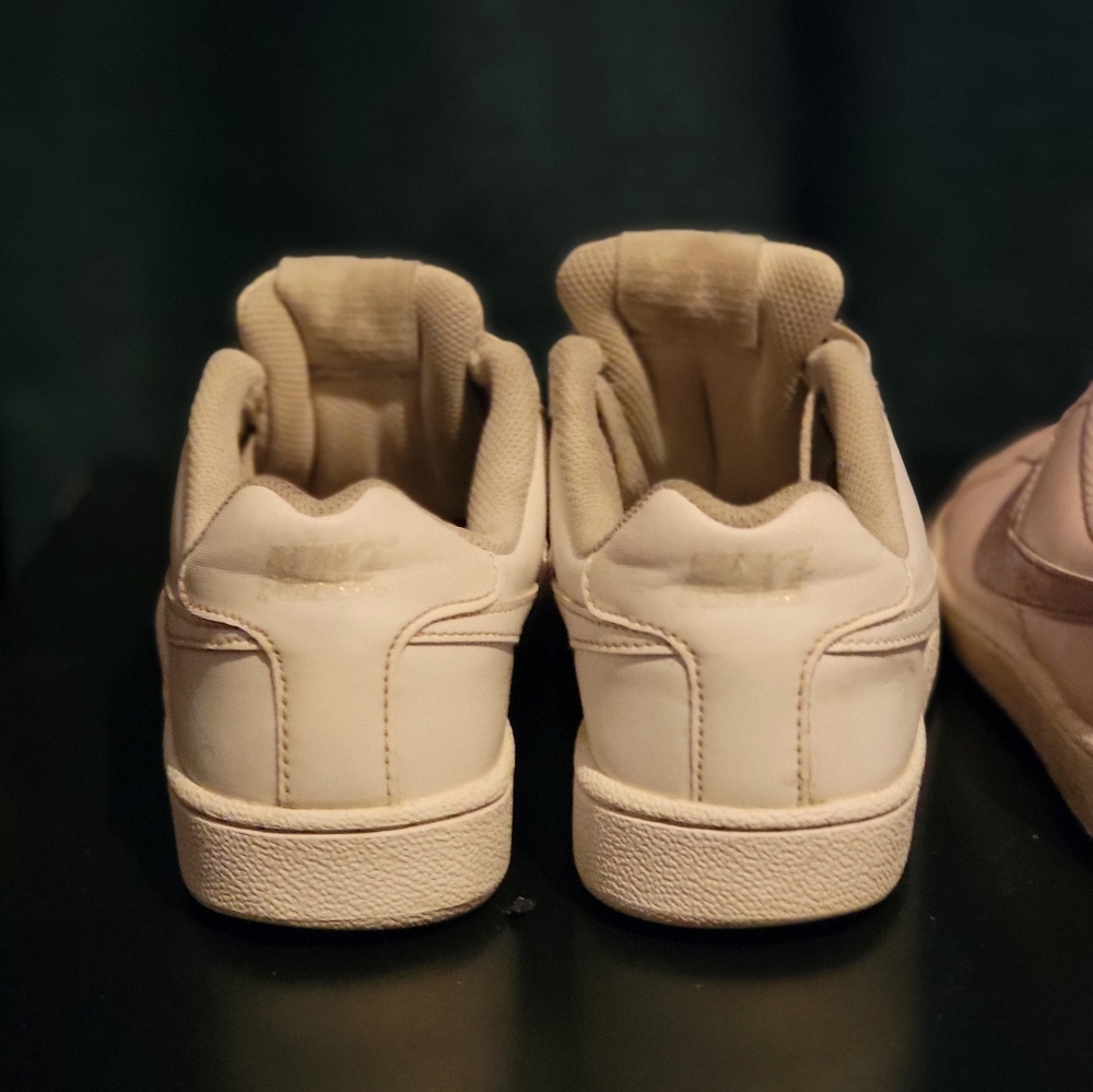 2 pairs of Nike shoes worn . Size 7